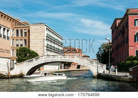 VENICE, ITALY - June 30, 2016.View of water street and old buildings in Venice on June 30, 2016. its entirety is listed as a World Heritage Site, along with its lagoon.June 30 VENICE, ITALY
