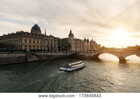 Boat tour on Seine river in Paris with sunset. Paris France
