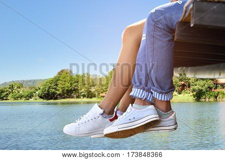 Couple sitting by the river outdoor summer