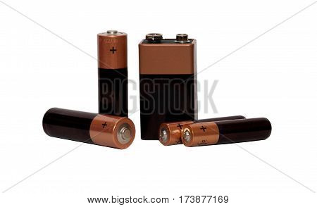 Many different batteries, type AAA, type AA, type PP3, white background, isolated