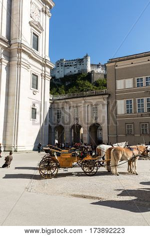 SALZBURG AUSTRIA - APRIL 29 2016: Fiaker at Cathedral Square in Salzburg Austria