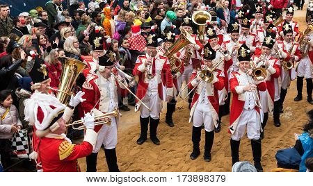 Marching band in uniform in the rose monday parade with audience - Participants of the rose monday parade in cologne on February 27, 2017