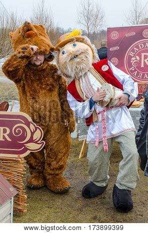 GOMEL BELARUS - FEBRUARY 21 2015: Traditional celebration of Shrovetide. Growth dolls on Shrovetide festivities at point of sale