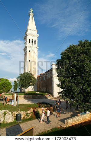 Rovinj Croatia - 23 August 2004: Tousists walking in front of Sant Eufemia Cathedral at Rovinj on Croatia