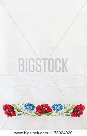 Embroidered Floral Pattern On A White Linen Towel