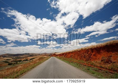 Road Through Madagascar Highland Countryside Landscape.