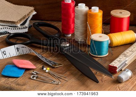 Spools Of Different Color Thread And Sewing Kit