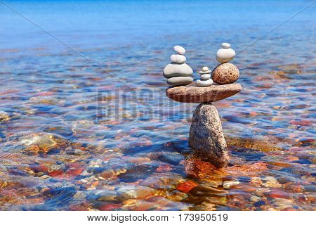 symbolic scales of standing stones in the water. balance and serenity concept