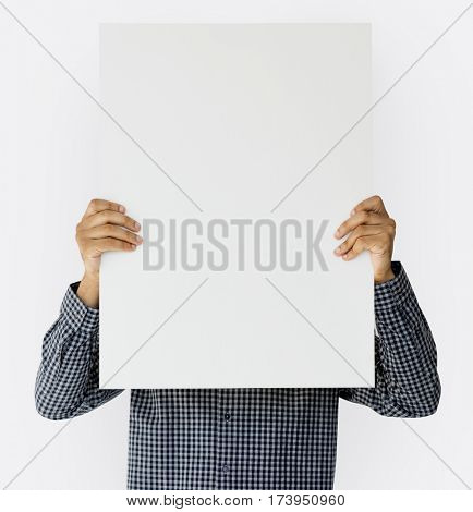 Man holding blank banner cover face studio portrait