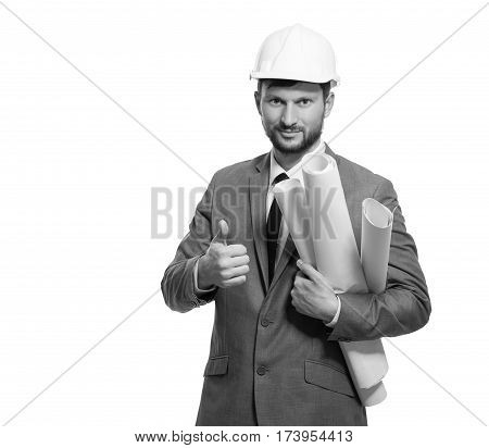 Studying blueprints. Smiling businessman engineer showing thumbs up wearing protective hardhat isolated on white copyspace architect work plan helmet protection safety professionalism project concept