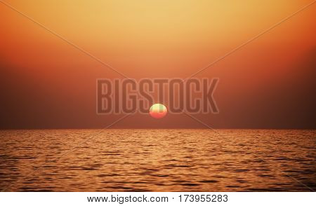 Sunset time at a sea horizon with a smoot gradient color.