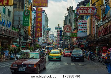 CHINATOWN Yaowarat BANGKOK THAILAND - November 23 2014: Cars and shops on Yaowarat road the main street of China town.