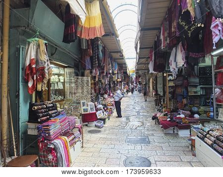 Jerusalem Israel - June 21 2015: scarves clothes and souvenirs for sale at the market located inside the walls of the Old City of Jerusalem