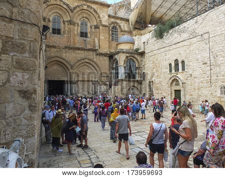 JERUSALEM ISRAEL - June 21 2015: Groups of tourists at the entrance to the Church of the Holy Sepulchre in the Old city of Jerusalem Israel