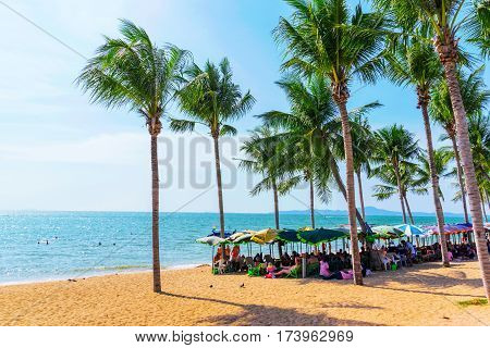 PATTAYA THAILAND - JANUARY 24: This is a view of Jomtien beach a popular tourist beach in Pattaya where many travellers come to sunbath on January 24 2017 in Pattaya