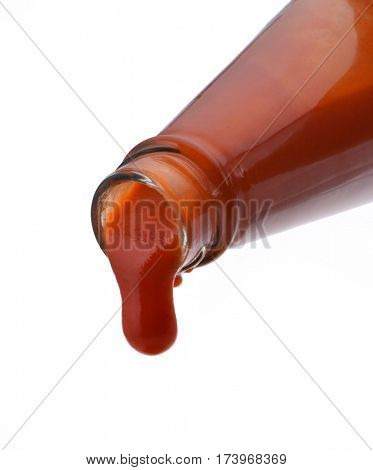 Tomato ketchup falling from bottle