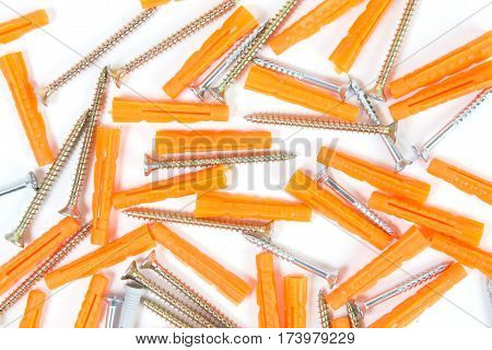 Screws and dowels isolated on white background.