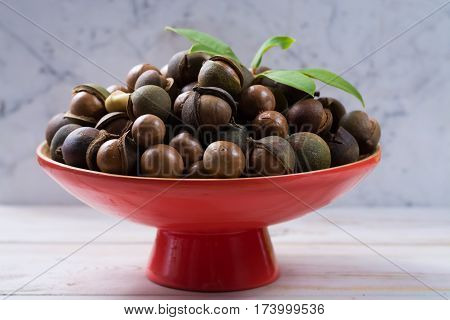 Macadamia nuts harvest close up with leaves