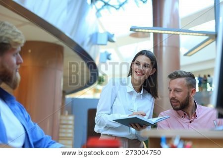 Group Of Young Modern People In Smart Casual Wear Having A Brainstorm Meeting While Standing In The 