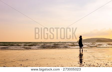 Single Young Woman On Beach When Sunset
