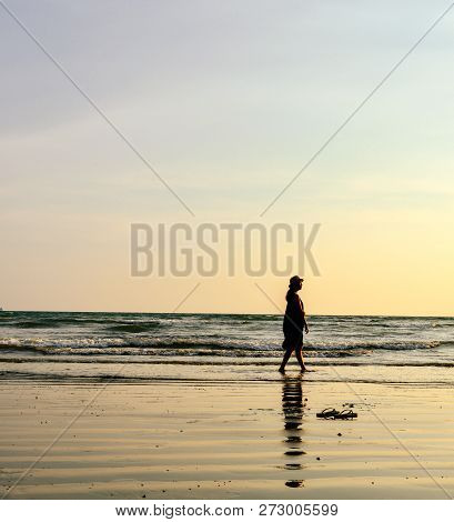 Single Young Woman On Beach When Sunset