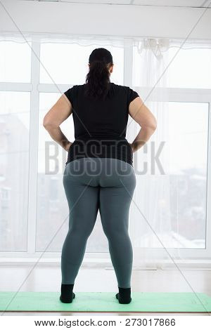 Weight Loss, Fitness, Sport, Exercising, Training And Lifestyle. Young Plus Size Woman Before Home W