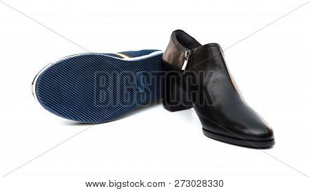 Blue Shoe For Husband And Black One For Wife On White As Filiation Concept