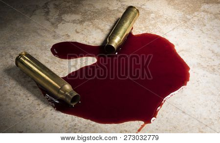 Floor With A Pool Of Blood And Ar-15 Cartridges That Have Been Shot