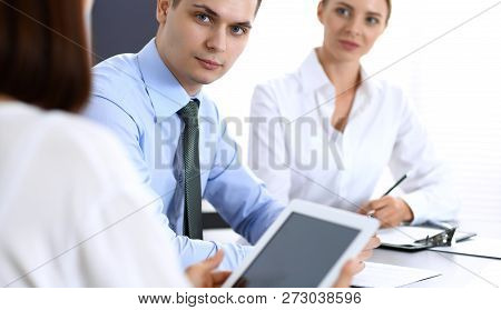 Group Of Business People Or Lawyers Discussing  Terms Of Transaction In Office. Colleagues Working A