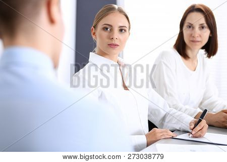 Group Of Business People Or Lawyers Discussing  Terms Of Transaction In Office. Colleagues Working A