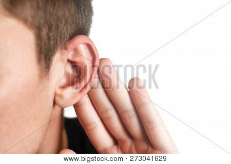 Man With Hearing Problem On White Background. Close Up.