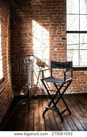 Directors Chair. Reflector Lamp Light From Window, Solar