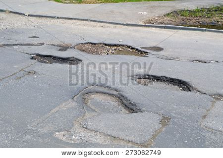 Bad Road. Broken Asphalt In Khimki, Moscow Region