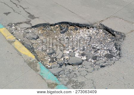Bad Road. Broken Asphalt In Khimki, Moscow Region