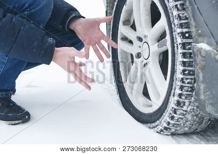 Driver Man Is Spreading His Hand And Confused By Flat Tyre Of His Car. Need A Car Air Compressor.