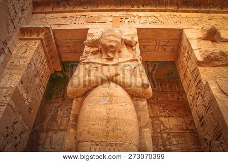 Statue Of Egyptian Pharaoh Ramses 3 In The Temple Of Medina Habu.