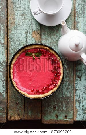 Minimalist Style Tea And Dessert. Homemade Lingonberry Pie And White Teaware On Old Shabby Blue Back