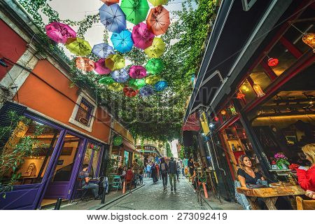 Istanbul, Turkey: Popular Street With Cafe At Balat Decorated With Colorful Umbrellas On October 20,