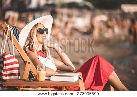 Girl Enjoying A Beautiful Sunny Day On The Beach