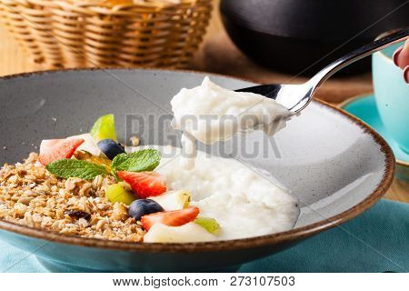 Rice Porrige With Strawberry On Breakfast In Cafe