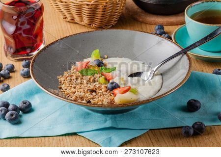 Rice Porrige With Strawberry On Breakfast In Cafe
