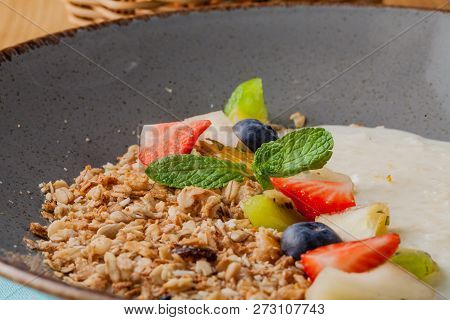 Rice Porrige With Strawberry On Breakfast In Cafe