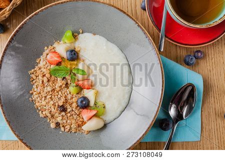 Rice Porrige With Strawberry On Breakfast In Cafe