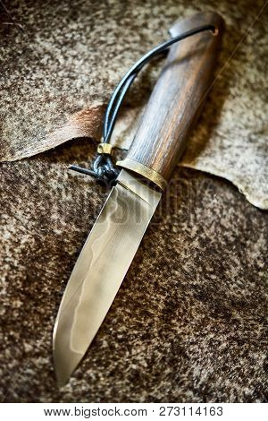 Hunting Knife With A Wooden Handle With Lambskin