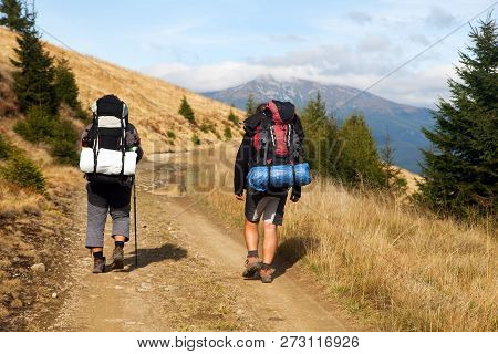 Mount Hoverla Or Goverla With Two Tourists, Ukraine Karpathian Mountains
