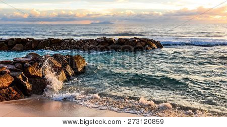 Breackwater  And Splash Of Wave With Sunset Light.