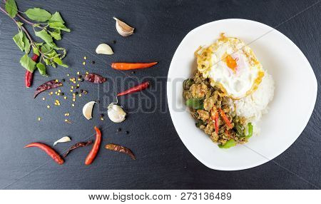 Spicy Thai Basil With Crispy Chicken And Egg (pad Krapow Gai) On Table . It Is A Very Delicious Thai