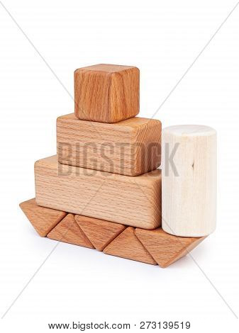 Photo Wooden Constructor Of Small Cubes, Triangles, Balls And Other Forms Of Beech On A White Isolat