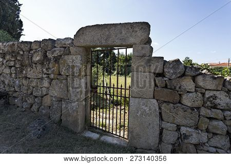 View Of A Wall Showing The Traditional Granite Stone Masonry Architecture In The Village Of Mesquite