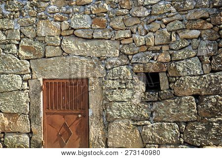View Of A Wall Showing The Traditional Granite Stone Masonry Architecture And A Ventilation Slot Of 